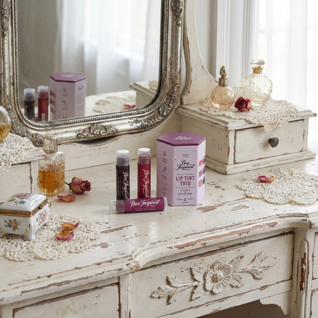 Vintage-style vanity with decorative items including a mirror, boxes, and bottles.