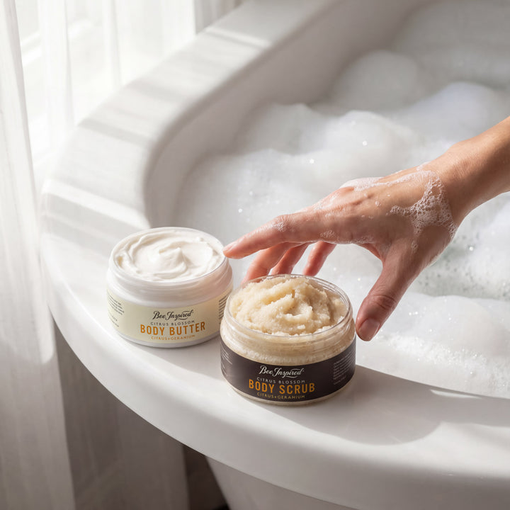 Two jars of body products on a bathtub rim with a hand reaching for one jar.