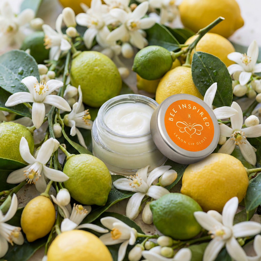 Lip balm with lemon and lime on a floral background