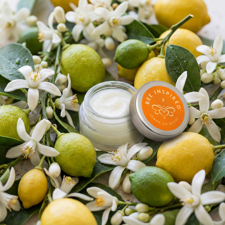 Lip balm with lemon and lime on a floral background